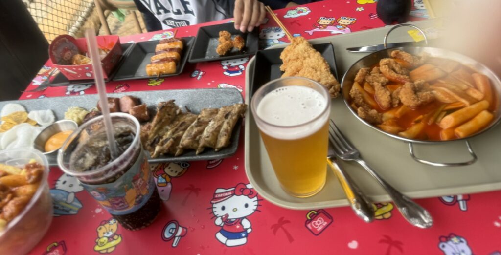 BBQ set lunch on a Sanrio-themed table at Caribbean Bay with kids
