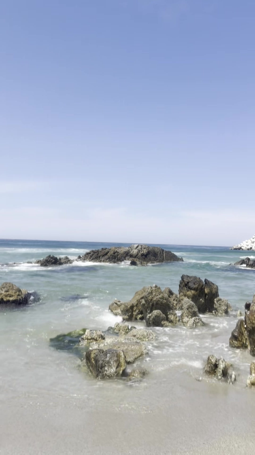 Munam Beach Samcheok rocky shore with waves breaking over dark rocks