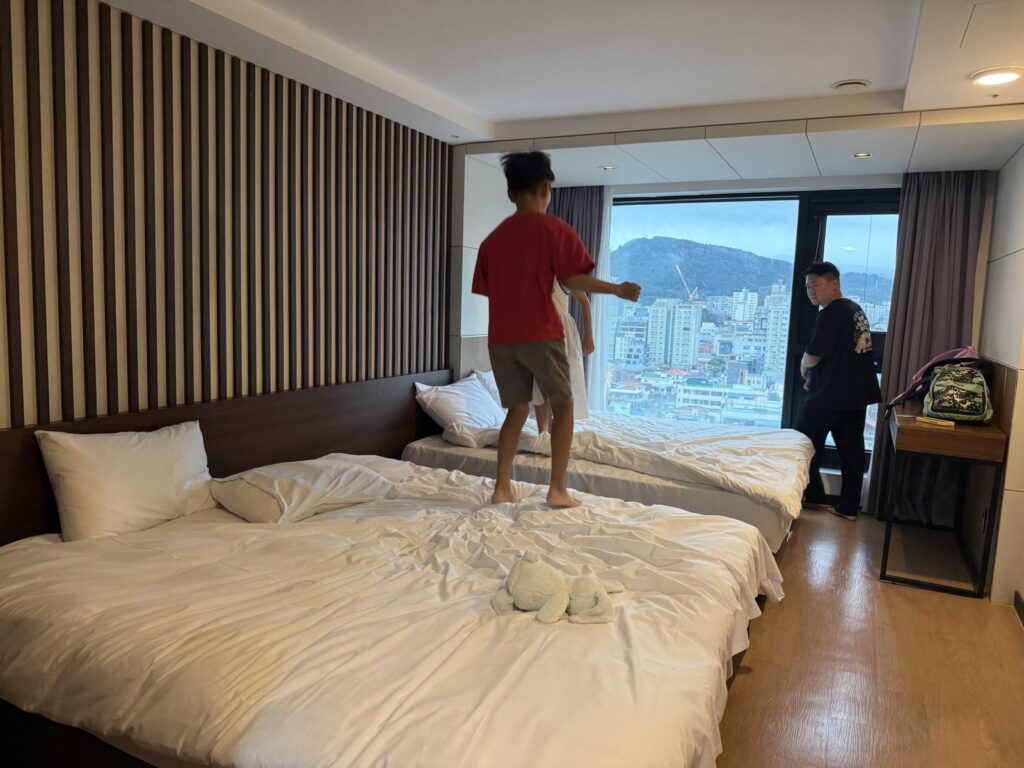 Hotel Aircity Jeju family room with a Jeju City view