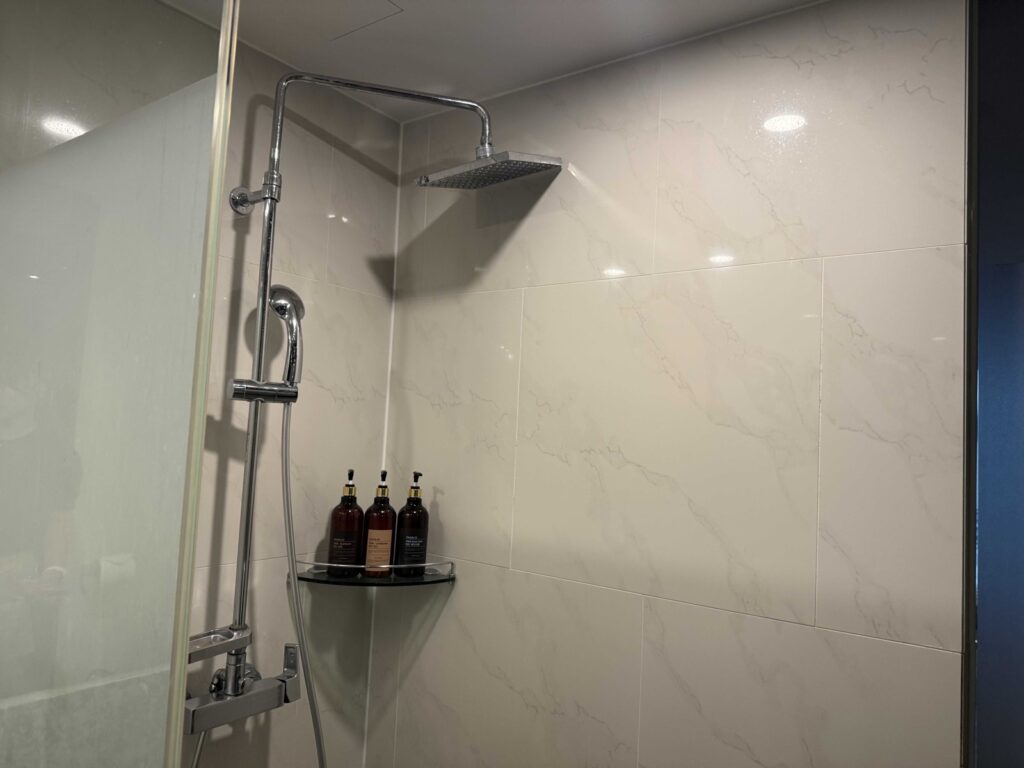 Hotel Aircity Jeju modern shower with toiletries