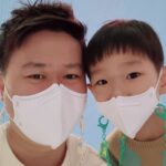 Jun Kim with his son