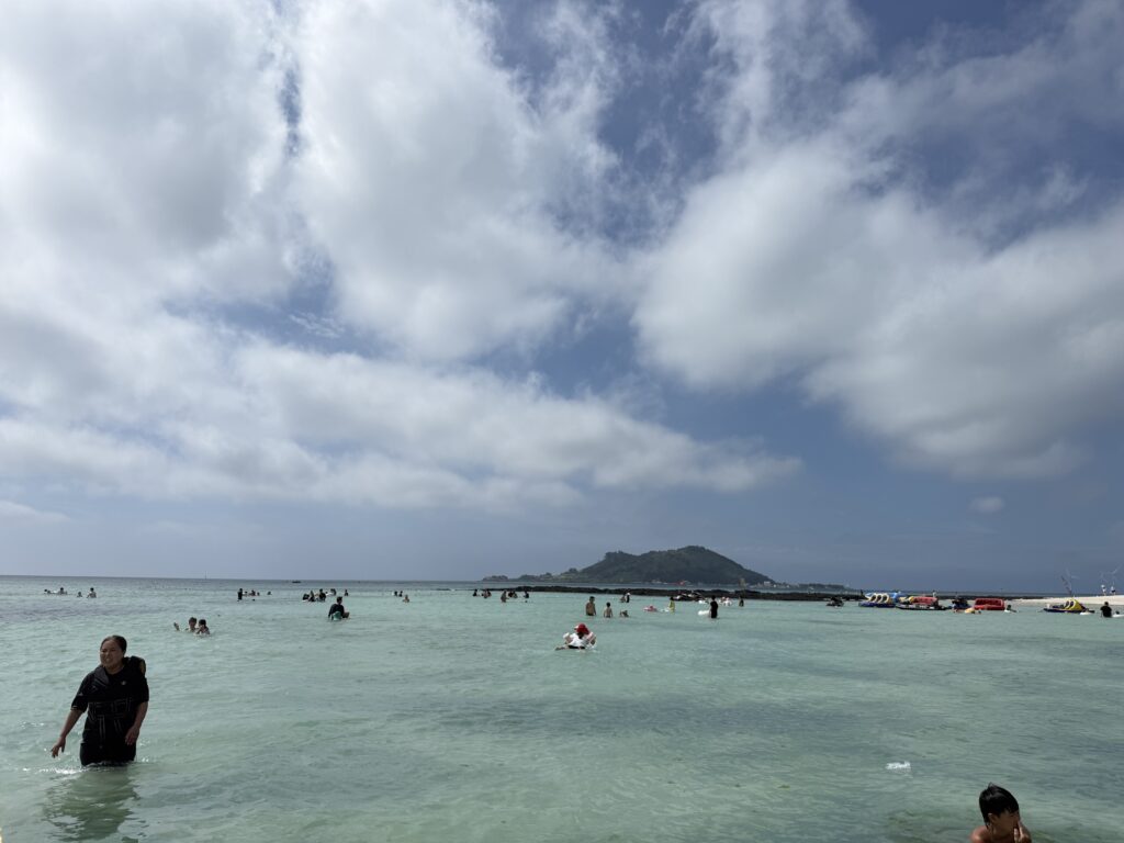 Turquoise shallow water and an offshore island at Segial Beach Jeju