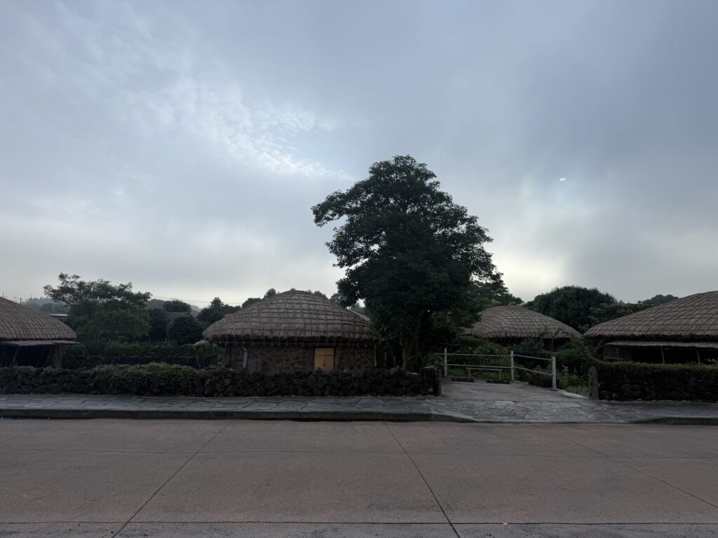 Thatched houses of Seongeup Folk Village at dusk