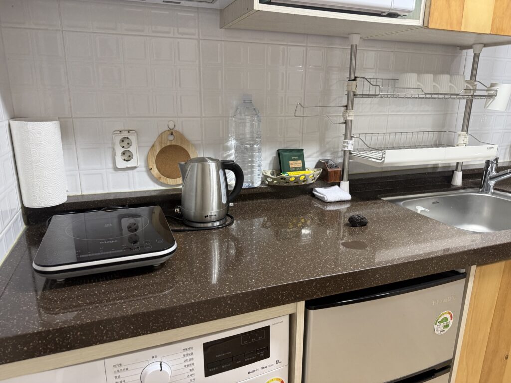 Modern kitchenette inside the traditional hanok at Seongeup