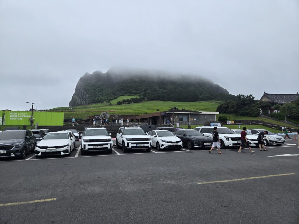 Seongsan Ilchulbong wrapped in mist seen from the parking lot