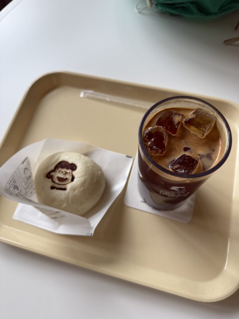 Snoopy steamed bun and iced coffee at the Snoopy Garden Jeju cafe