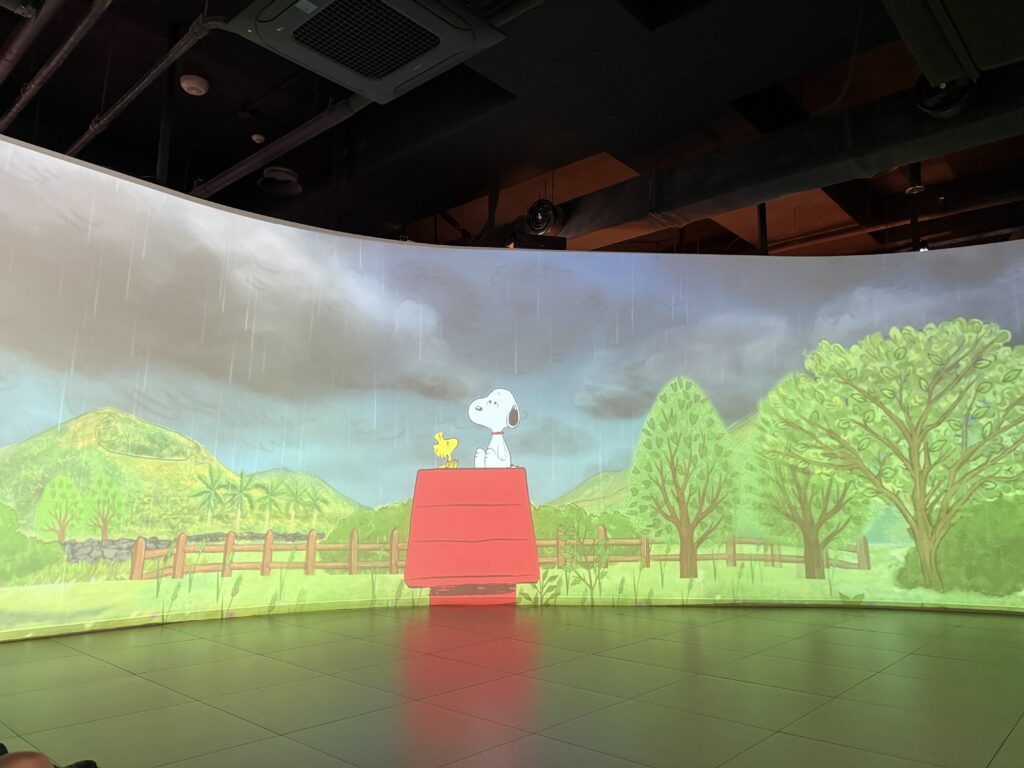 Immersive Snoopy theater with a curved screen at Snoopy Garden Jeju
