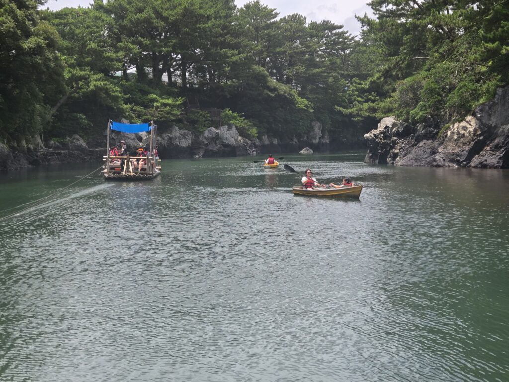Boats paddling through the emerald gorge at Soesokkak with kids