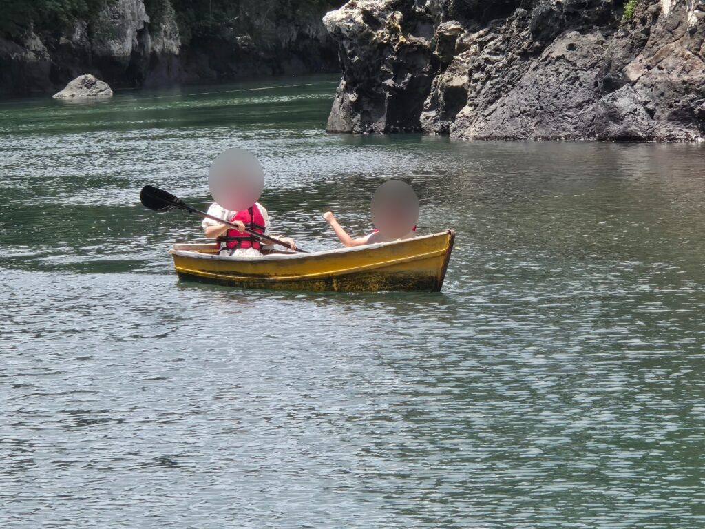 A family boat on the calm green water at Soesokkak